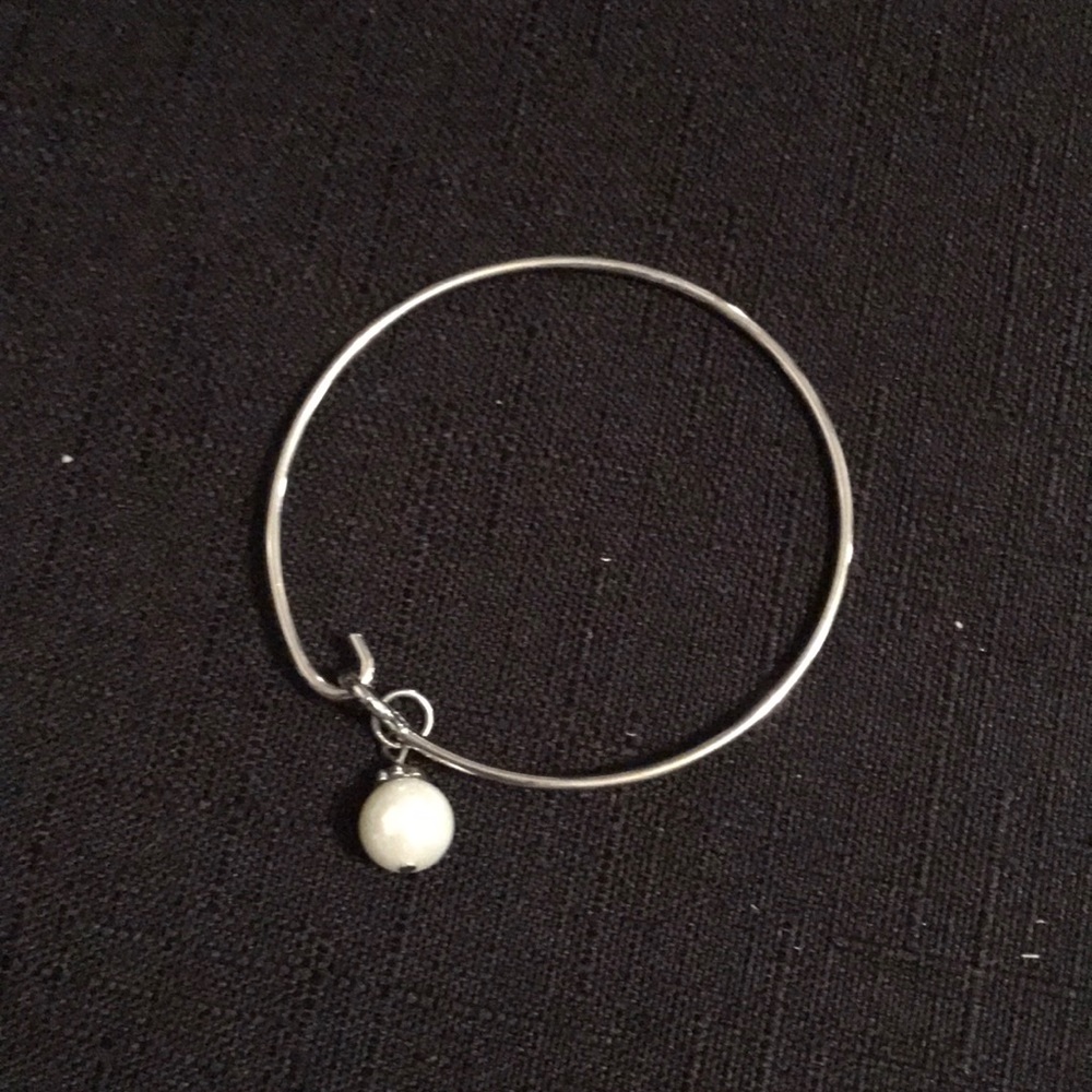 A Swarovski pearl charm bangle bracelet